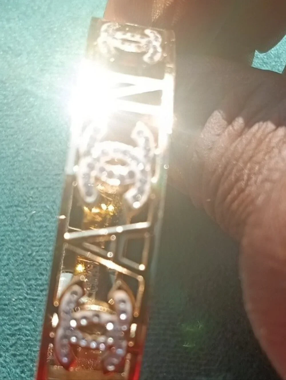 CHANEL Gold Cut-Out Logo Bangle